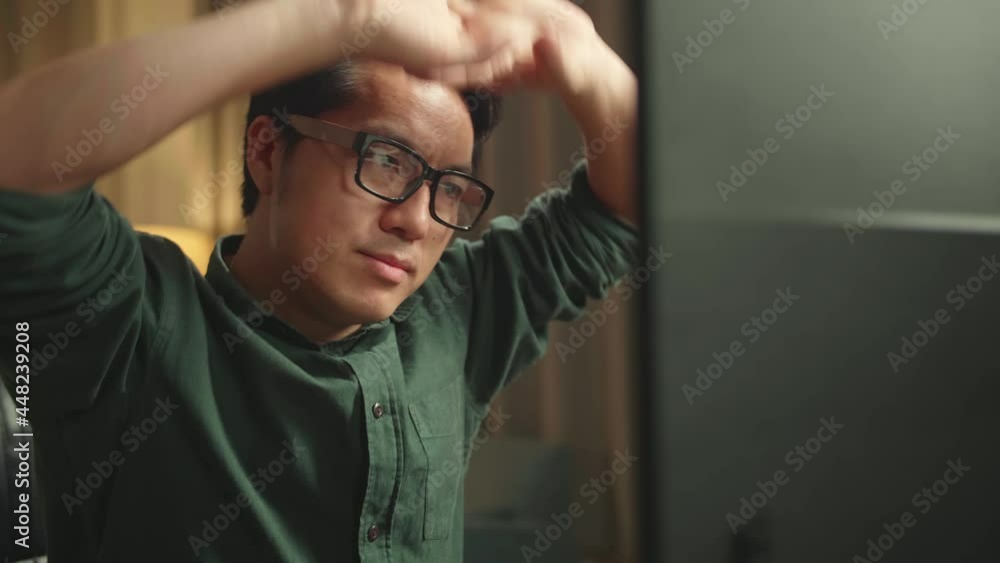 Close Up Asian Man Stretching While Works On Personal Computer And 3D Printer In Home Office, He Works At Night
Close Up Asian Man Stretching While Works On Personal Computer And 3D Printer In Home Office, He Works At Night