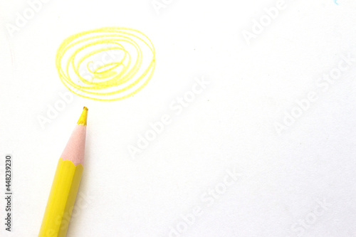 yellow pencil with twirl on white background. High quality photo