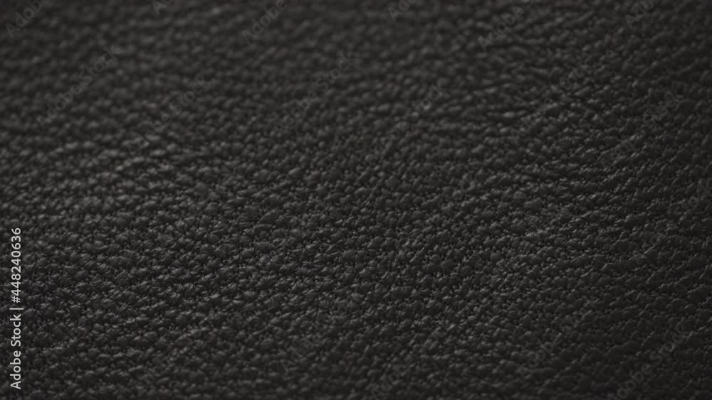 Slow motion handheld shot of soft gray brown leather closeup Slow motion handheld shot of soft gray brown leather closeup