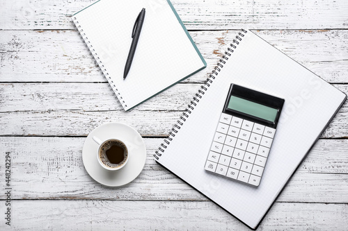 Calculator, pen, and coffee...