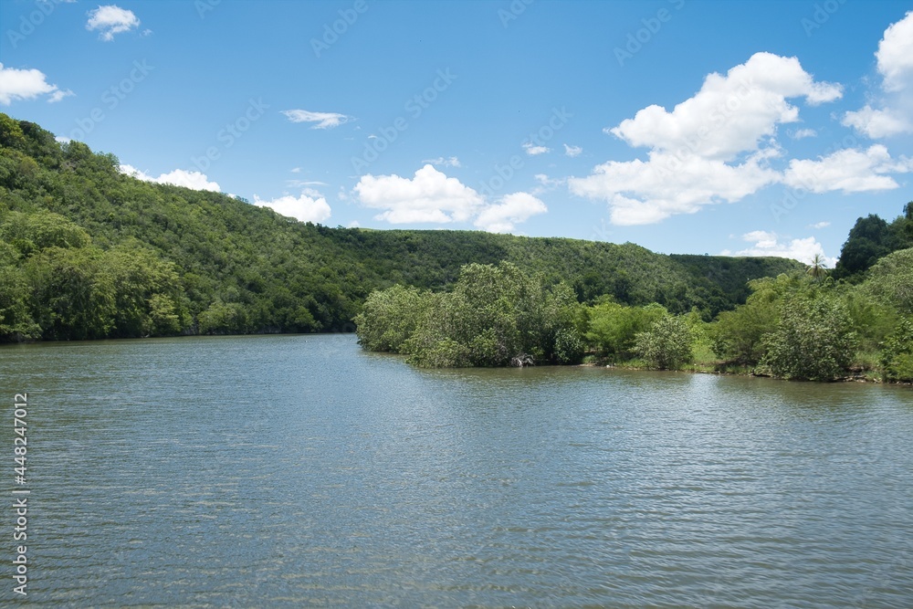 Natural landscape of the Chavon River in the Dominican Republic, in Summer. Wild nature. Natural landscape of the Chavon River in the Dominican Republic, in Summer. Wild nature.