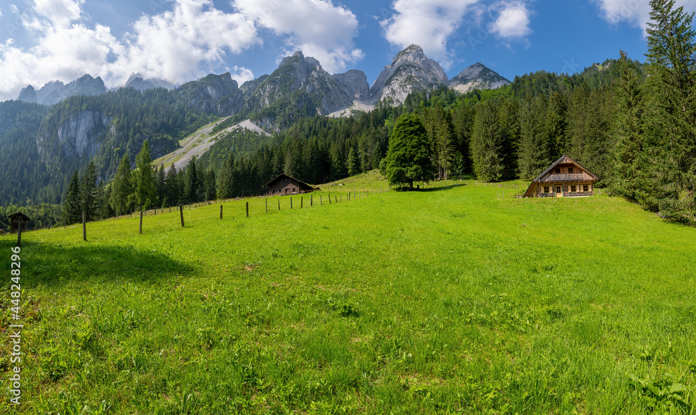 Gosau, Austria; July 31, 2021 - Log cabins around Gosausee, a beautiful lake with moutains in Salzkammergut, Austria.