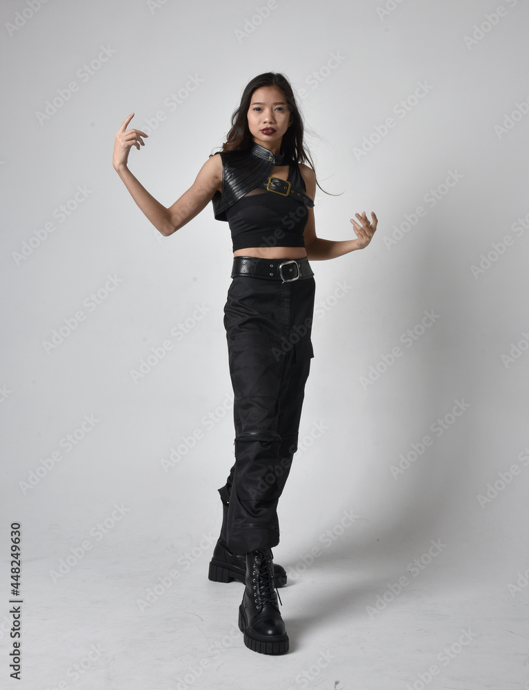 Full length portrait of pretty young asian girl wearing black tank top ...