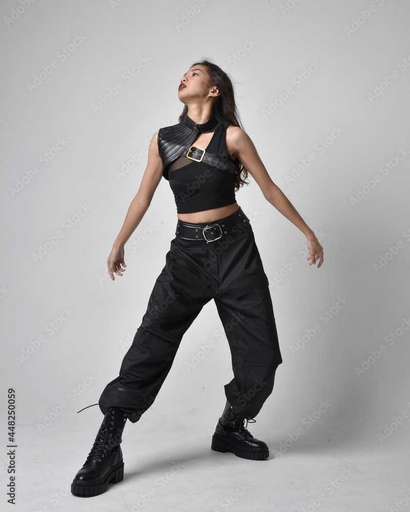 Full length portrait of pretty young asian girl wearing black tank top ...