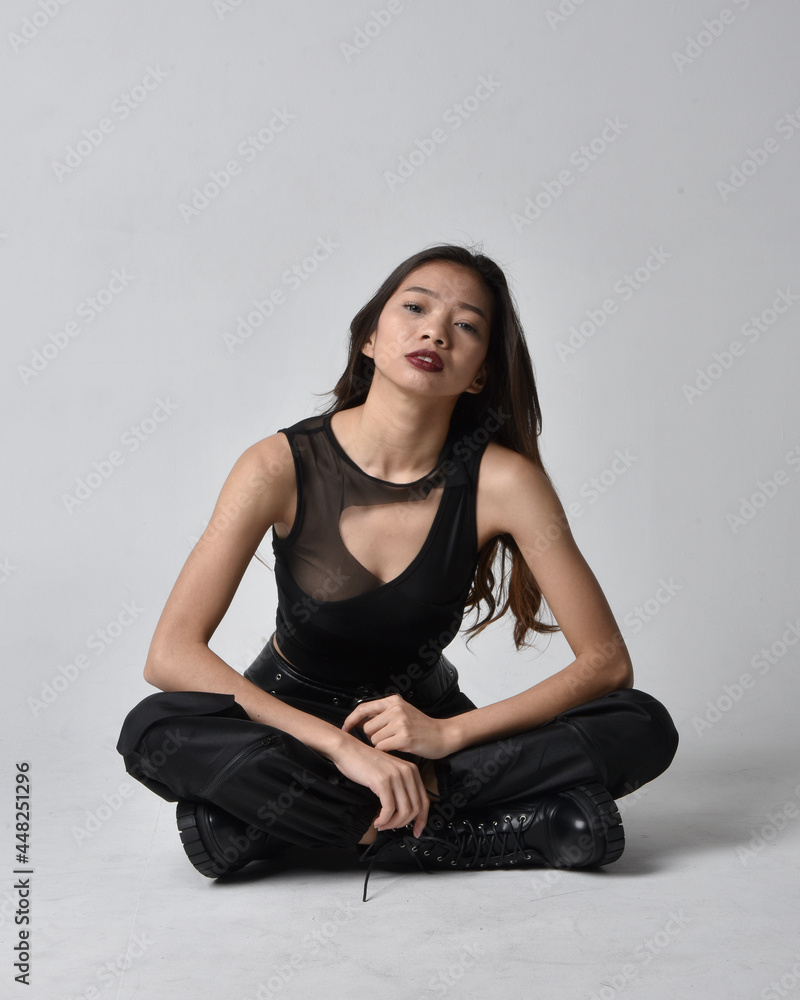 Full length portrait of pretty young asian girl wearing black tank top ...