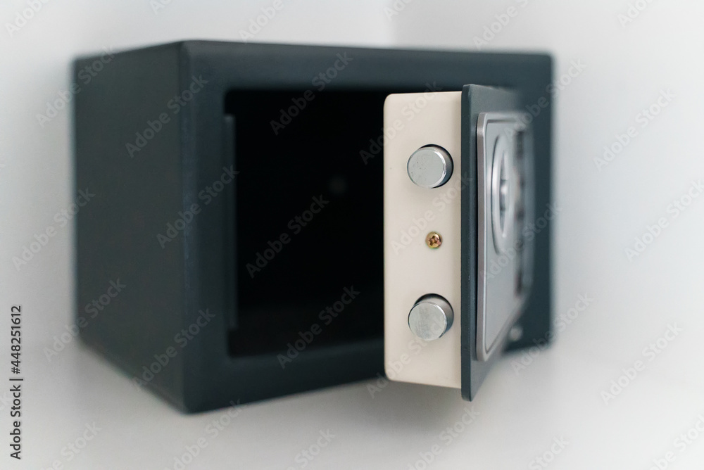 Black small home or hotel safe with keypad.