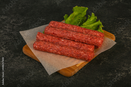 Raw beef sausages with spices