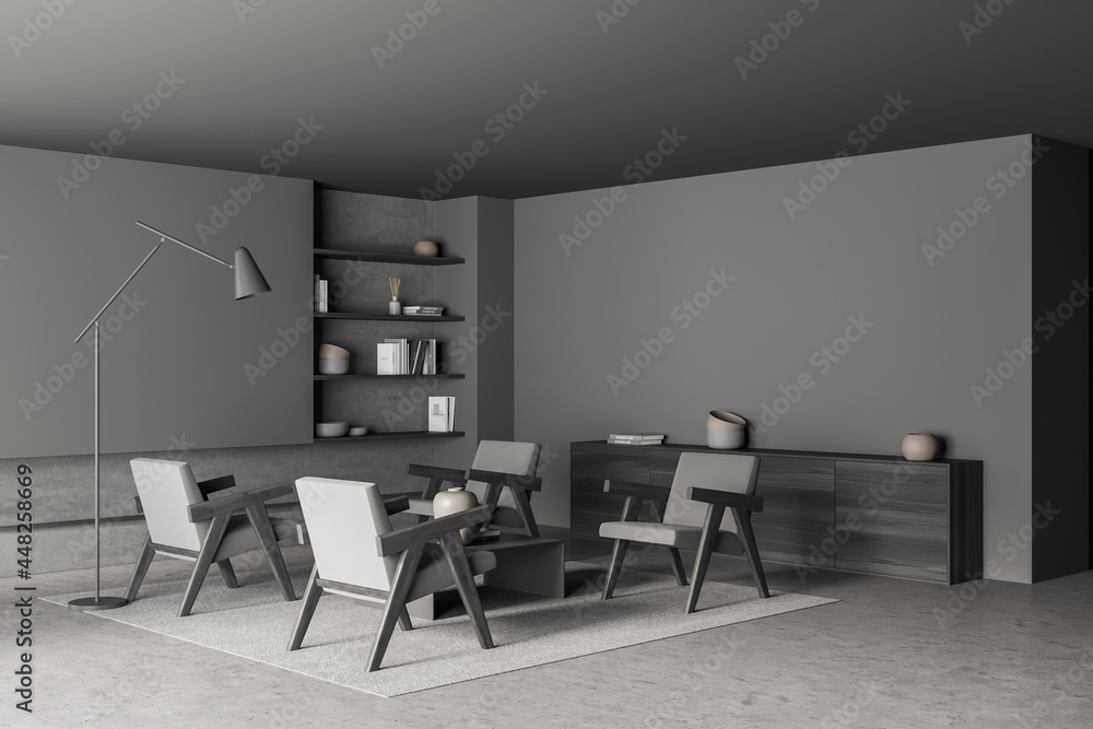 Dark grey-hued living room with armchairs and slim lamp