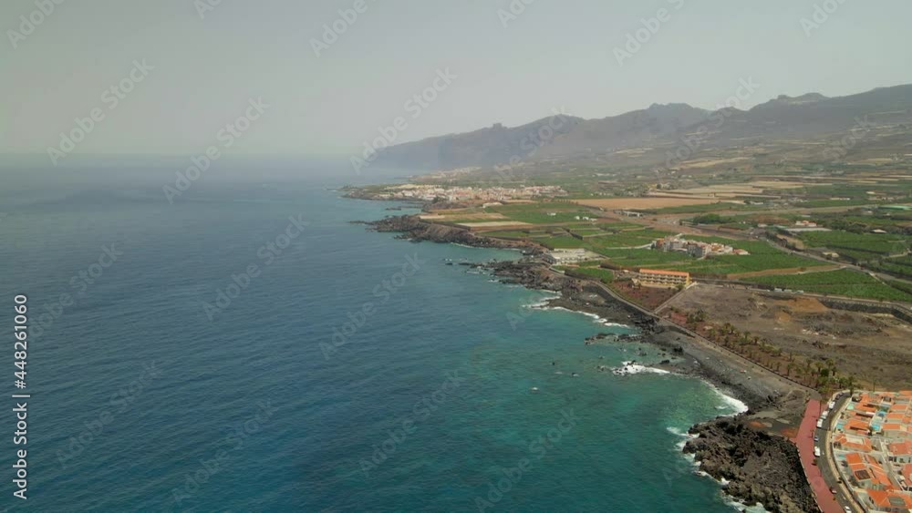 Tenerife, San Juan a town on the Atlantic Ocean. Sunny coast and port city. Ocean, water, waves, blue ocean. Tenerife, San Juan a town on the Atlantic Ocean. Sunny coast and port city. Ocean, water, waves, blue ocean.