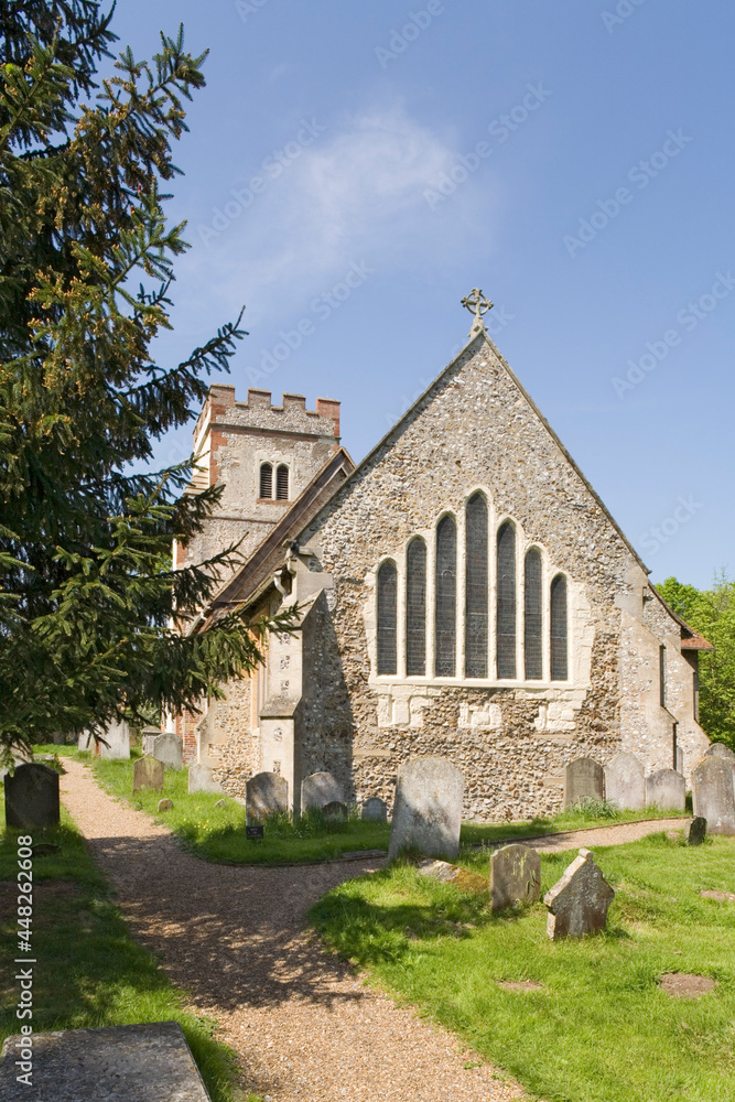 All Saints church at Ockham, Surrey, with a rare seven lancet window in the east end of the chancel