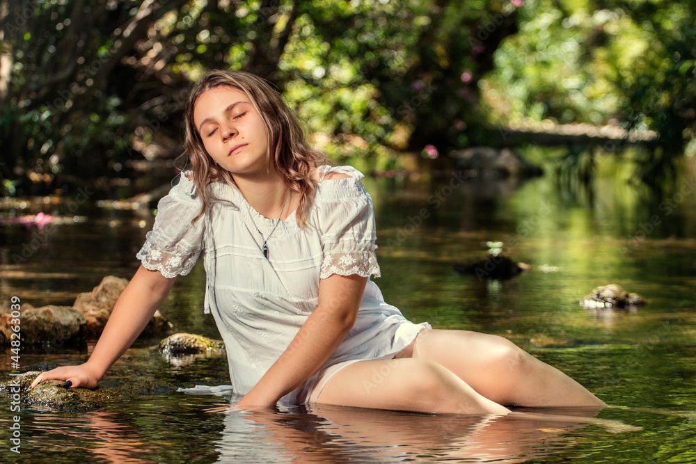 woman with white dress near stream of water woman with white dress near stream of water