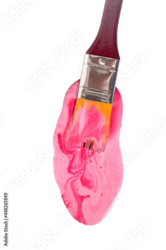 paintbrush immersed on pool of ink photo