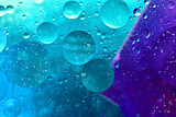 Close-up shot of water bubbles floating on a blue background.