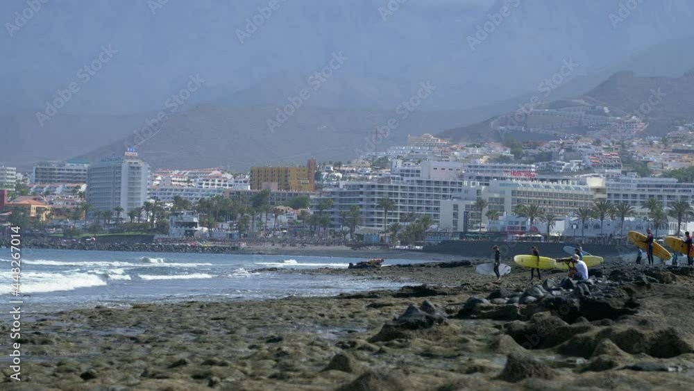 Tenerife Canary Islands a hot day on the Atlantic Ocean. Dry ground, rocks on the beach and surfing. Tenerife Canary Islands a hot day on the Atlantic Ocean. Dry ground, rocks on the beach and surfing.