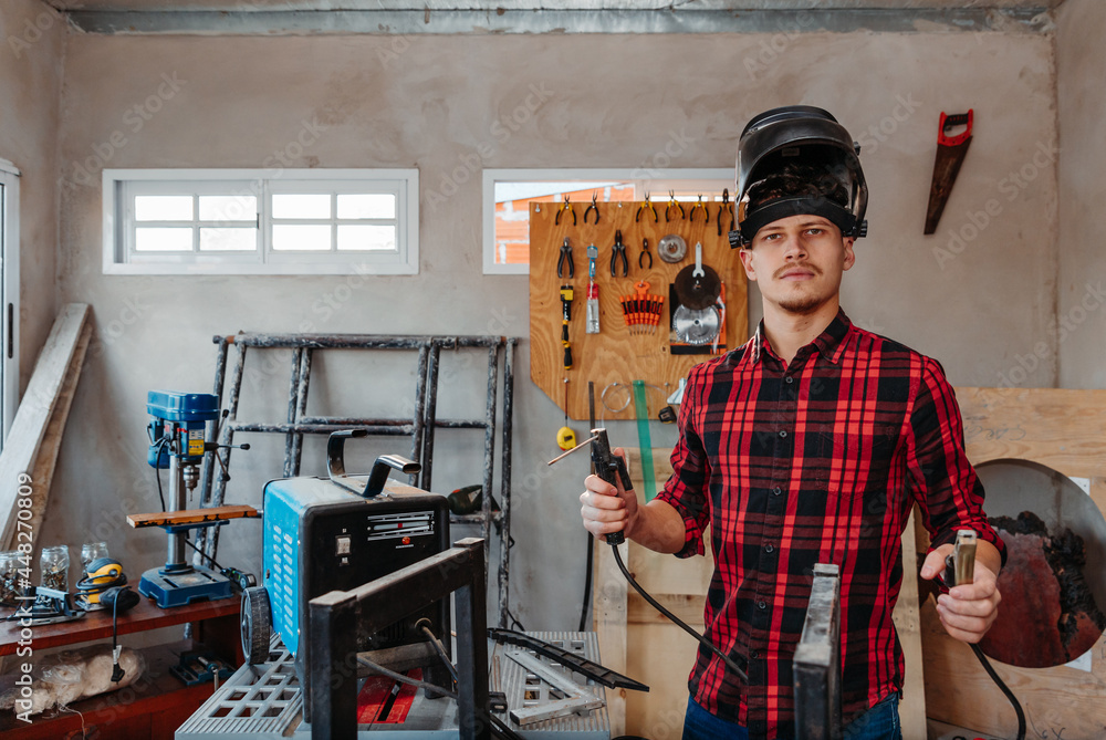 Fototapeta premium carpenter welding in his carpentry