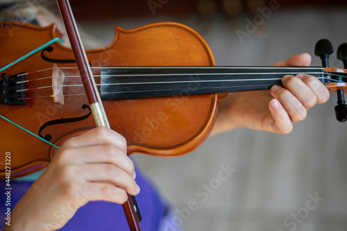 little violinist playing the violin top view, horizontal