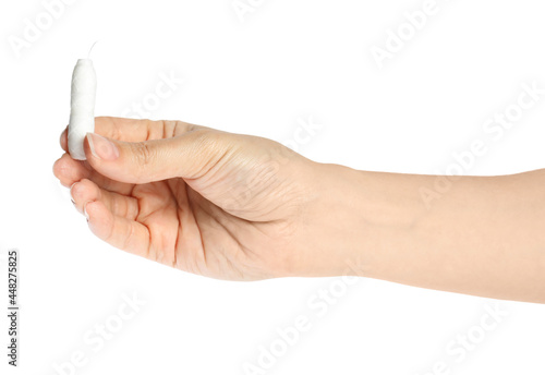Woman holding natural dental floss on white background, closeup