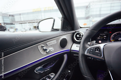 Control buttons on steering wheel. Car interior. © sarymsakov.com