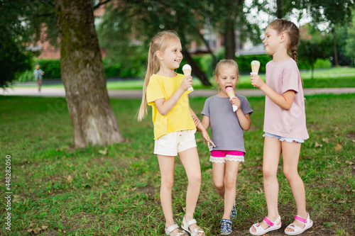 Children licking ice cream refreshing in the park. Ice Cream Summer Refreshment