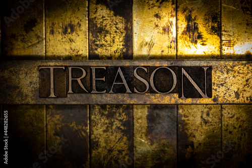 Фотография Treason text on textured grunge monochrome metal background