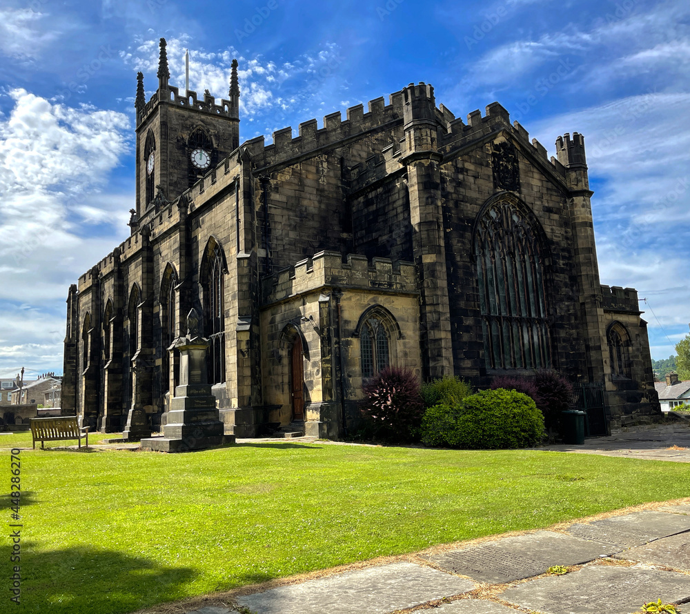 Old stone built church, dating back to 1826, set against a blue sky in, Shipley, Bradford, UK