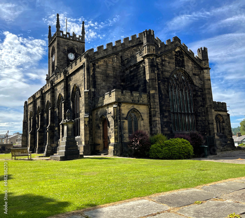 Old stone built church, dating back to 1826, set against a blue sky in, Shipley, Bradford, UK