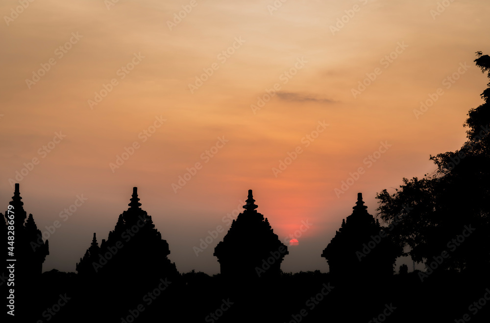 Beautiful sunset scene with Plaosan Buddhist temple silhouette Beautiful sunset scene with Plaosan Buddhist temple silhouette