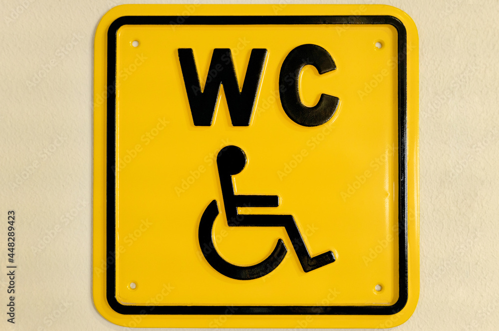 A WC signpost for disabled people. A WC signpost for disabled people.