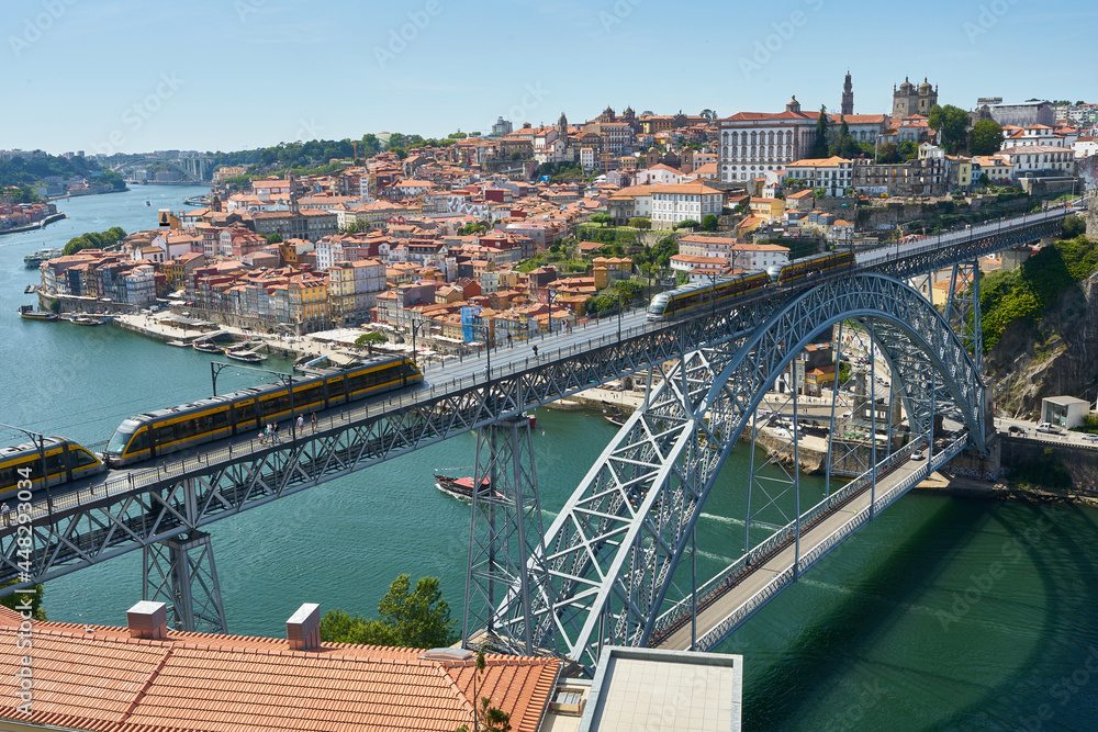 The tram of Porto crossing Louis I Bridge, Portugal