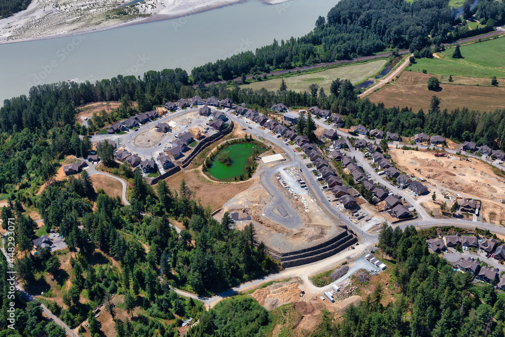 Aerial View of Residential Homes and Construction Site on a hill. Harrison Mills near Chilliwack, British Columbia, Canada.
