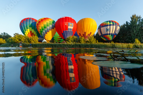 Suzdal, Vladimir region  Russian Federation - 07 22 2021:hot air balloon festival reflected in the water
