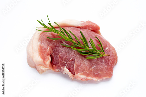 Pork meat with rosemary on white background.