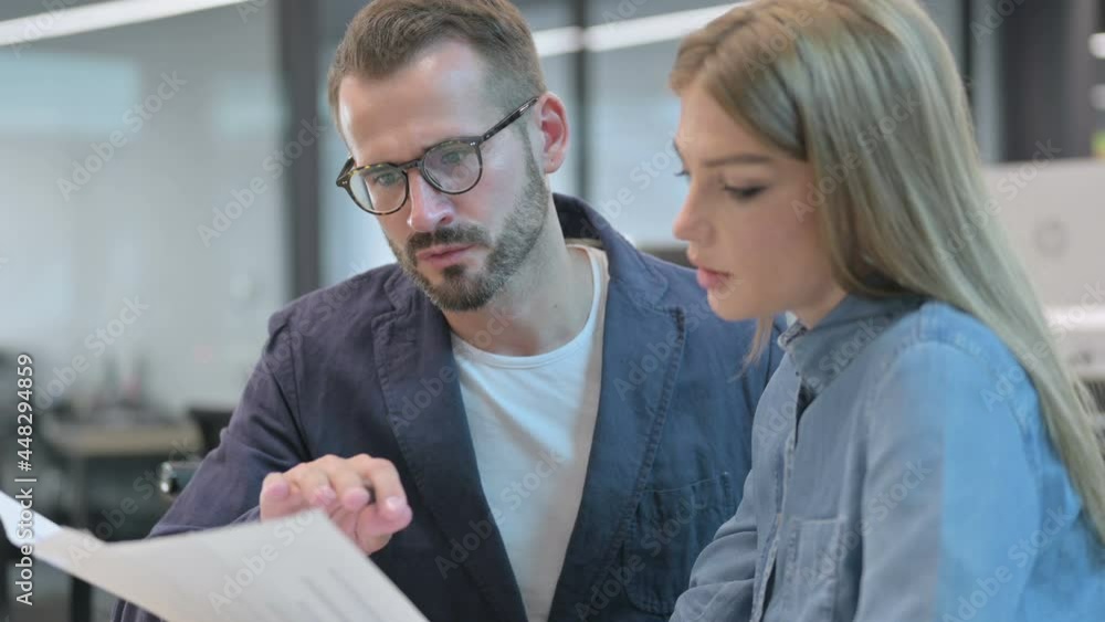 Woman Explain Documents to Male Colleague Woman Explain Documents to Male Colleague