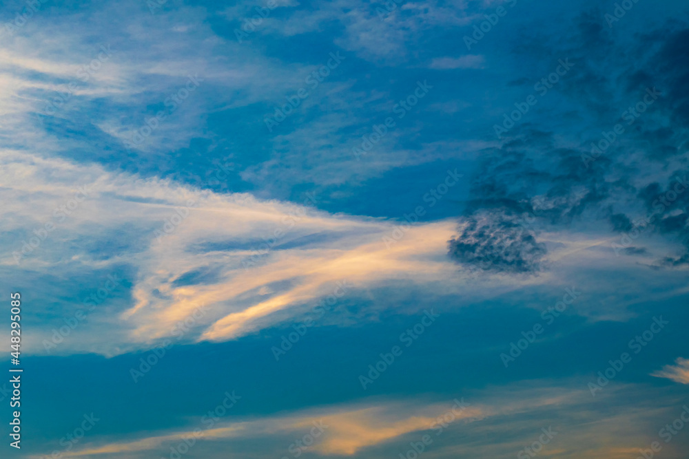 Evening summer sky sky in the yellow rays of the setting sun. Abstraction. Evening summer sky sky in the yellow rays of the setting sun. Abstraction.