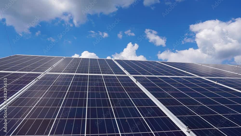 Close-up of modern photovoltaic solar battery panels. Solar panels on roof top. Blue sky on the background Close-up of modern photovoltaic solar battery panels. Solar panels on roof top. Blue sky on the background