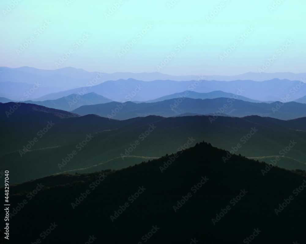 Foggy Horizon of Blue Misty Mountains in Background Far View