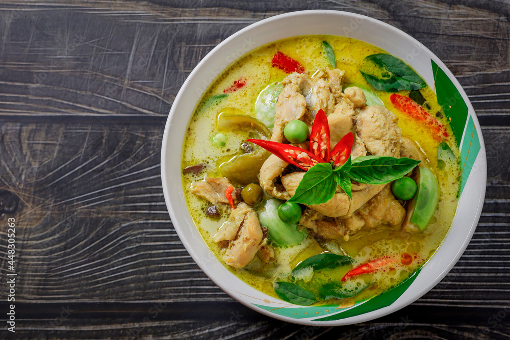 Chicken Green Curry In a white bowl circle on the table top Thai food concept. Chicken Green Curry In a white bowl circle on the table top Thai food concept.