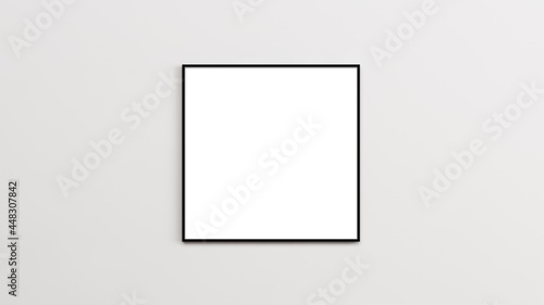 Square frame mockup. Black thin border square frame on the empty white wall.
