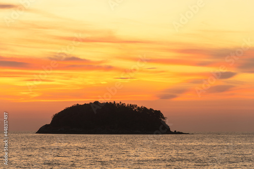 scenery yellow sky the sun going down to the sea..beautiful golden sky at sunset in Kata beach Phuket Thailand.high quality image for travel concept.