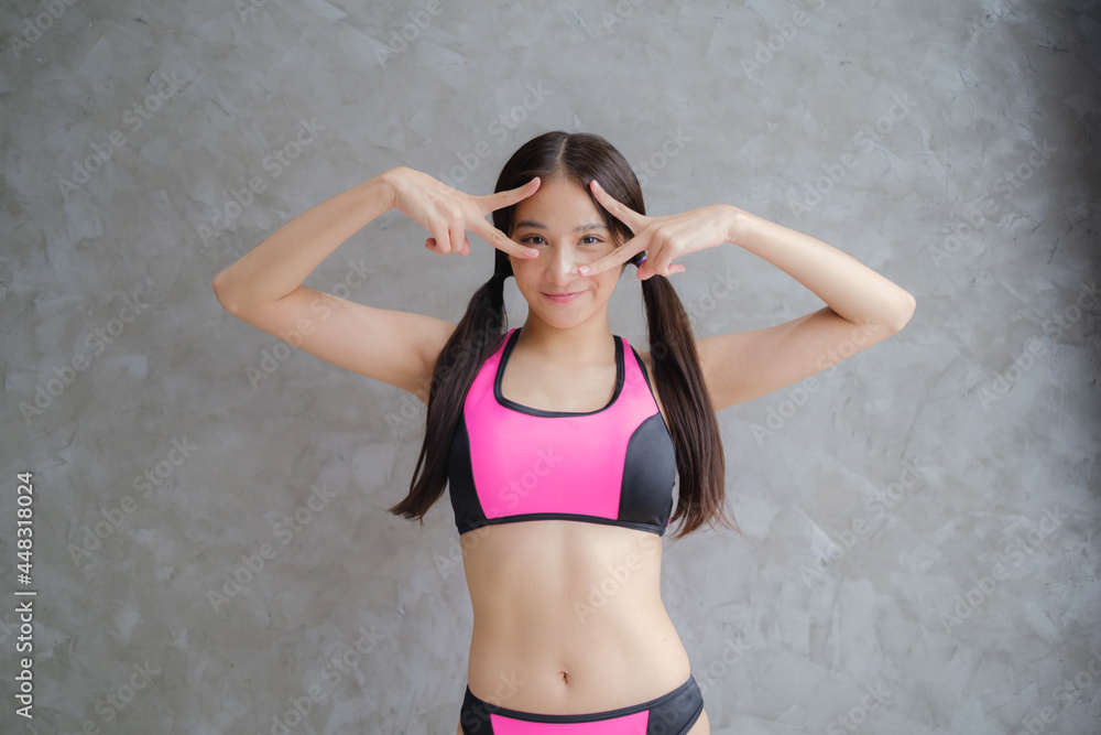 Fototapeta premium Woman wear bikini and sport suit.