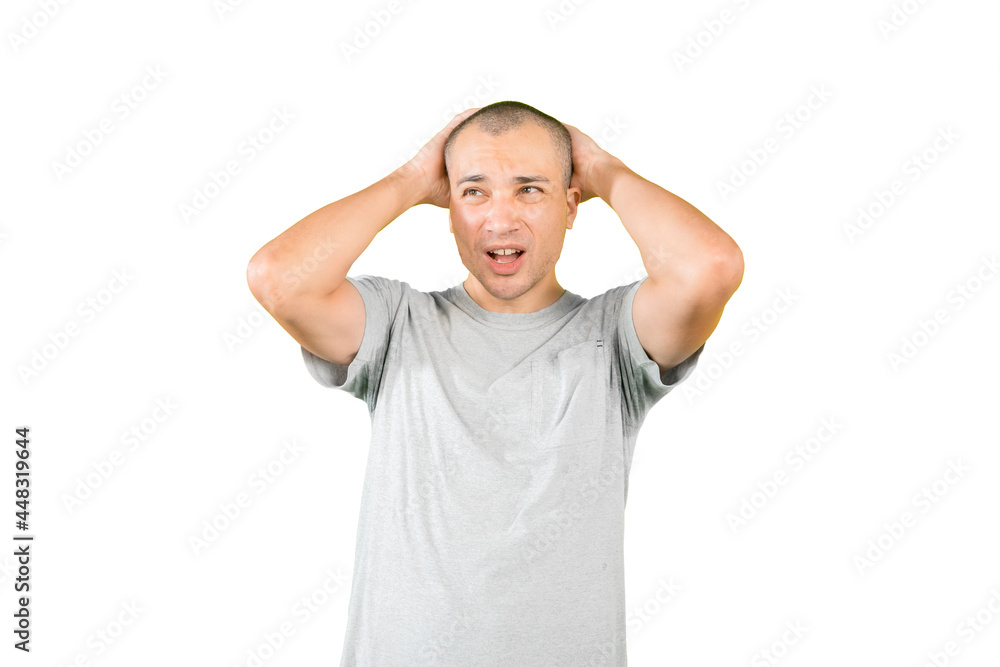 Frustrated man scratching his head on studio Frustrated man scratching his head on studio