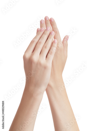 Beautiful hands of a woman with perfect manicure. Isolated over white background.