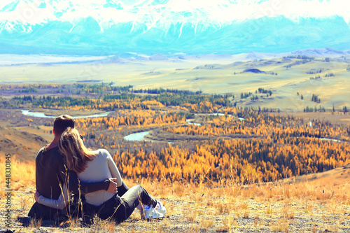 couple hugging in mountains landscape, romance happiness adventure together active