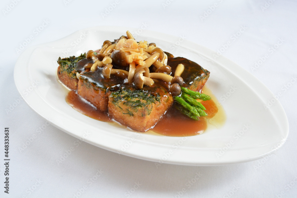 braised handmade spinach vegetable bean curd tofu with mushroom in oyster sauce in white background asian halal menu