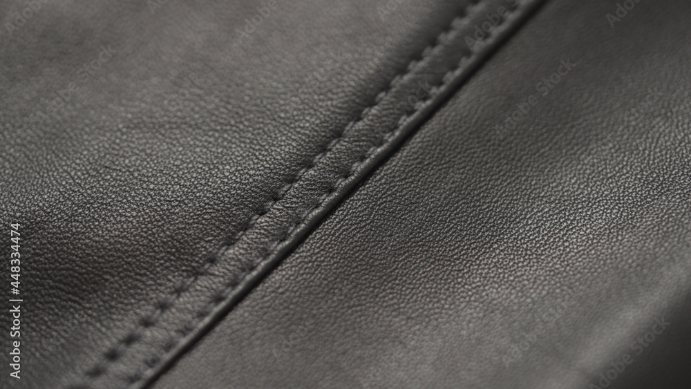 closeup of soft gray brown leather with seam closeup of soft gray brown leather with seam