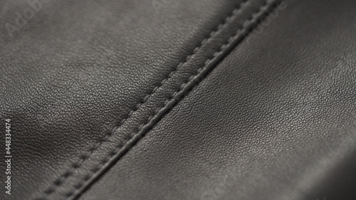 closeup of soft gray brown leather with seam