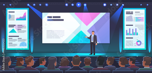 Conference or presentation of a company's product. A male speaker stands on stage and presents a new project or report