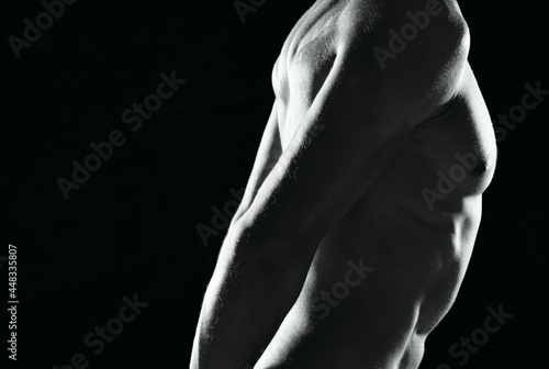 a man in black panties an inflated body black and white photo fitness