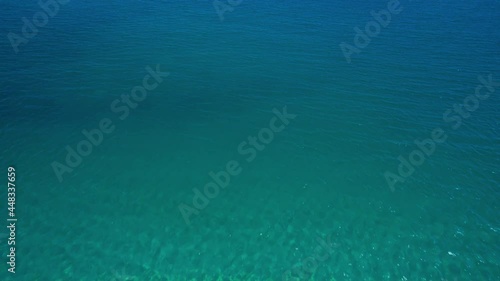 真夏の北海道の砂浜から海へと向かう空撮 photo