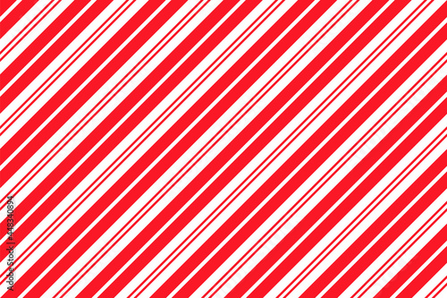 Candy cane striped pattern. Seamless Christmas red background.Cute caramel package texture. Xmas holiday print with diagonal lines. Peppermint geometric wrapping paper. Vector illustration